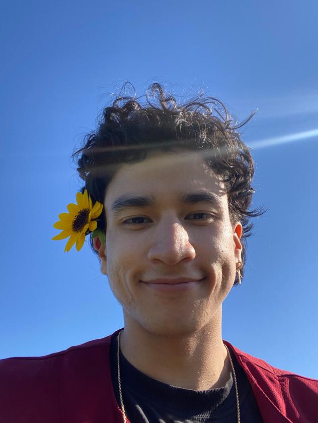 Picture of Eliseo with a flower